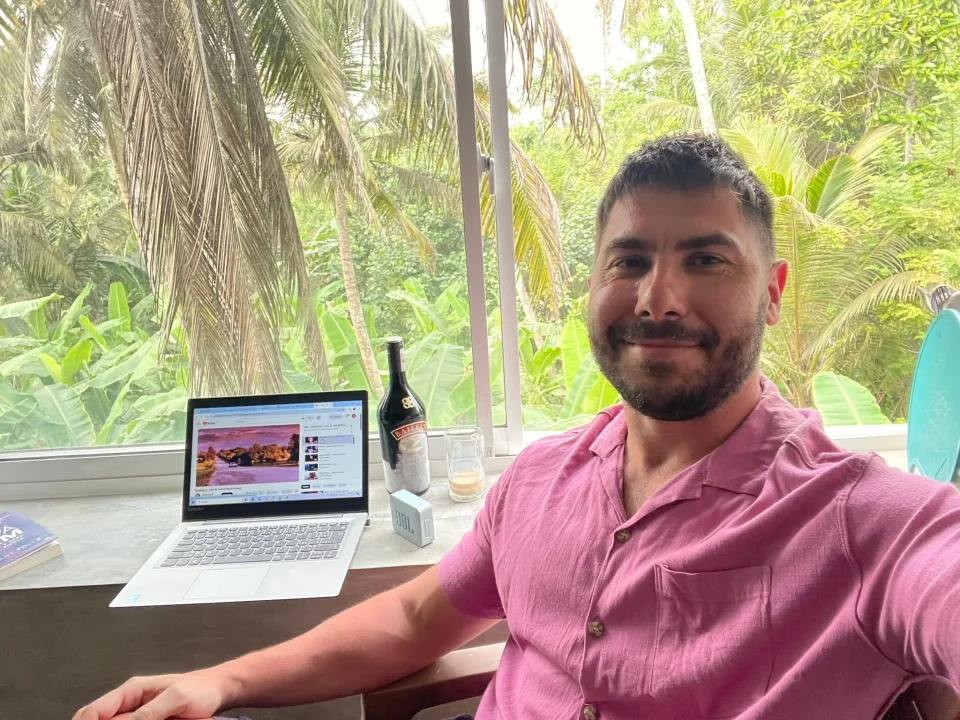Personal photograph by a window overlooking greenery